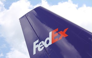 A FedEx plane delivering dental appliances from a dental lab